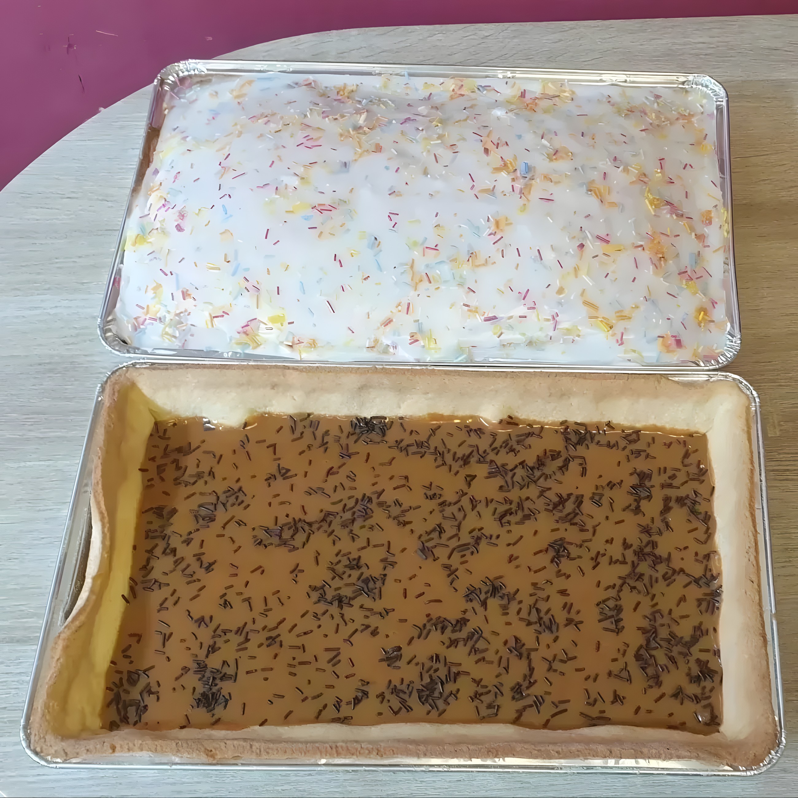 Trays of sponge and semolina cakes topped with sprinkles