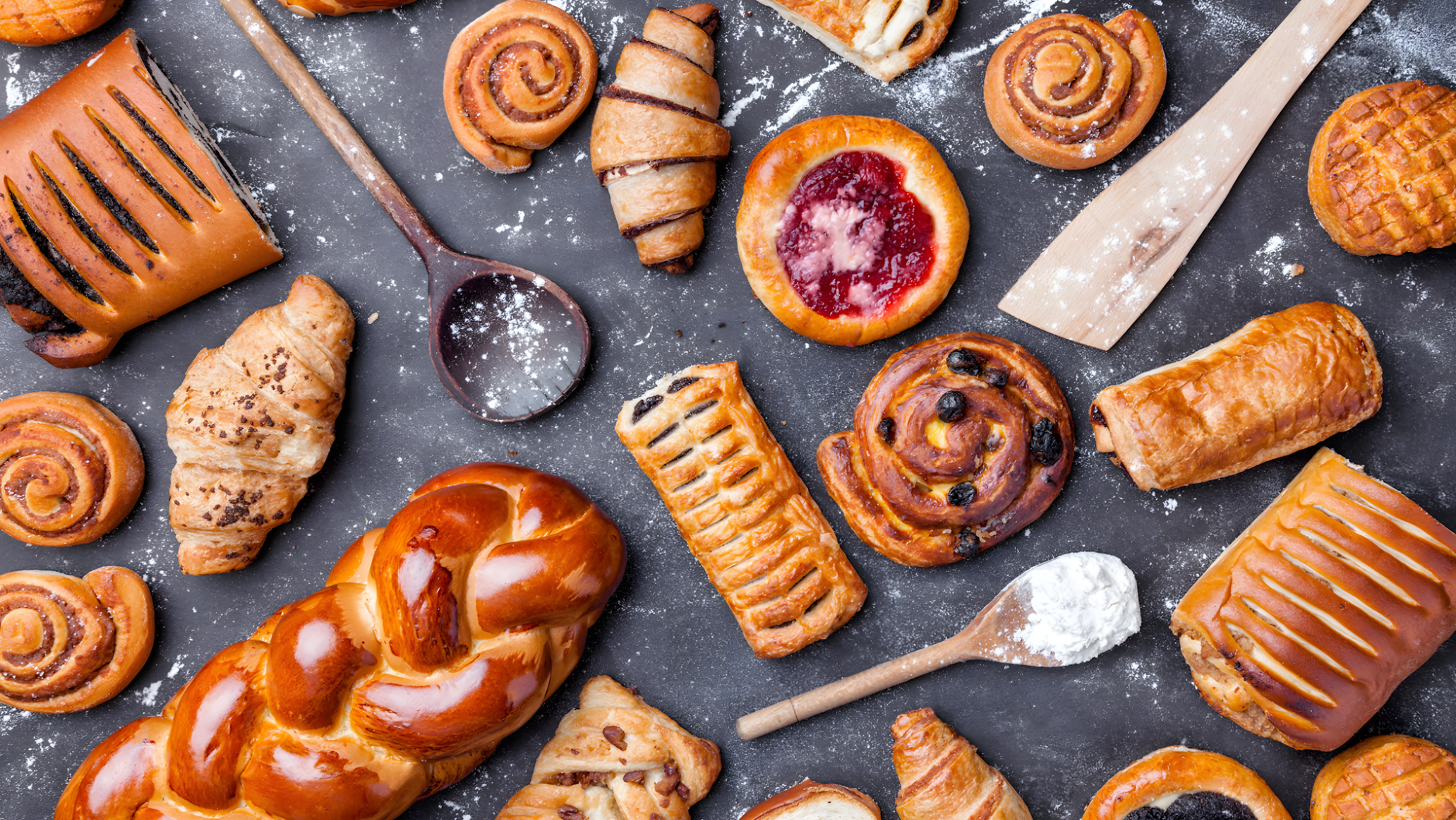 A spread of freshly baked pastries and breads at Premier Bakes